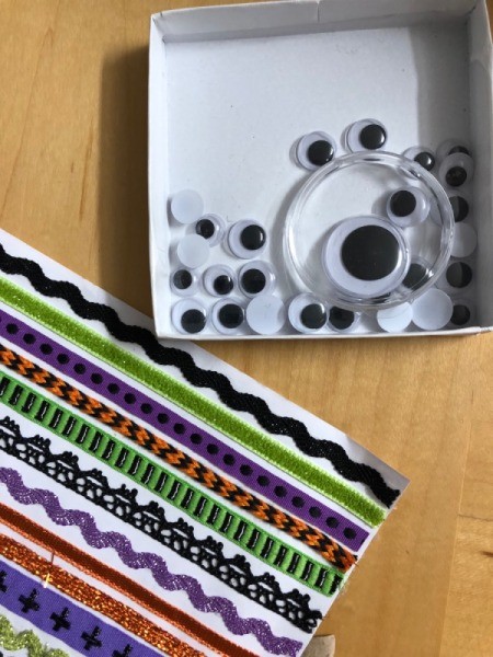 Decorated Paper Pumpkins - google eyes and sticker ribbon