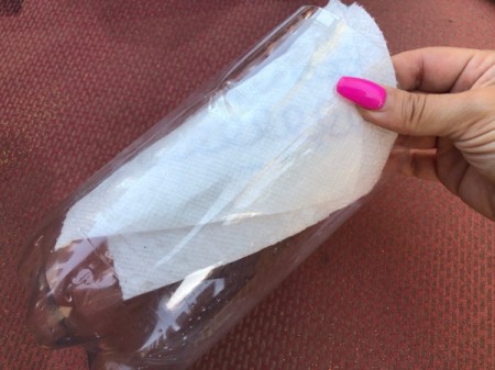 Plastic Bottle Tiara - wiping moisture out of cut bottle