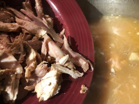 adding chicken to  Soup