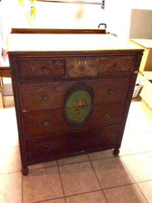 Value of an Old Dresser - old dresser with ornate floral medallion on center of two drawers