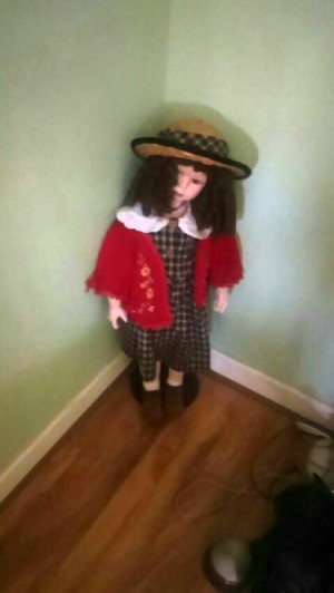 Value of a Limited Edition Knightsbridge Porcelain Doll - doll wearing a plaid dress and straw hat