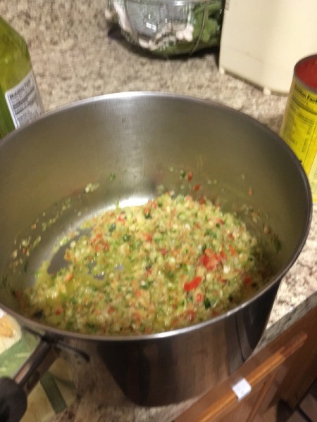 olive oil and minced and chopped veggies in pan