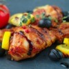 Balsamic Chicken with olives and lemon wedges.
