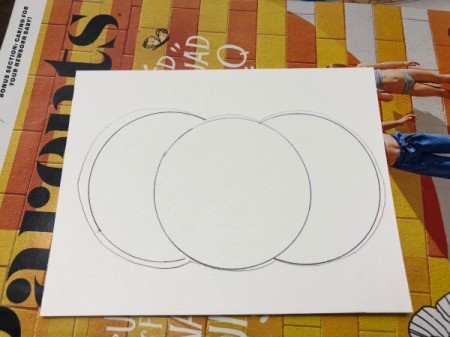 A step in making a Halloween card with a decorative pumpkin silhouette.