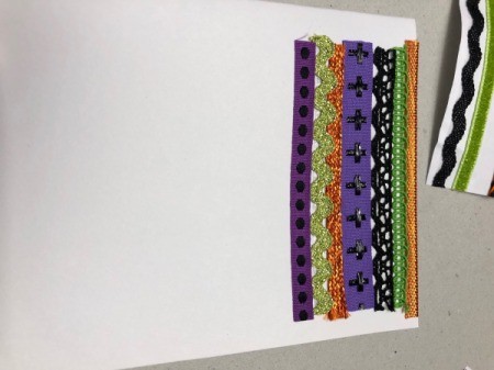 A step in making a Halloween card with a decorative pumpkin silhouette.