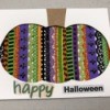 A finished Halloween card with a decorative pumpkin silhouette.