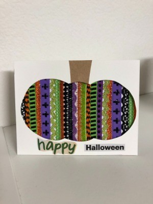 A finished Halloween card with a decorative pumpkin silhouette.