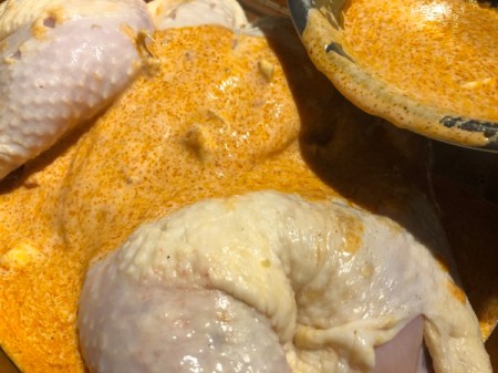 adding spice mix to chicken