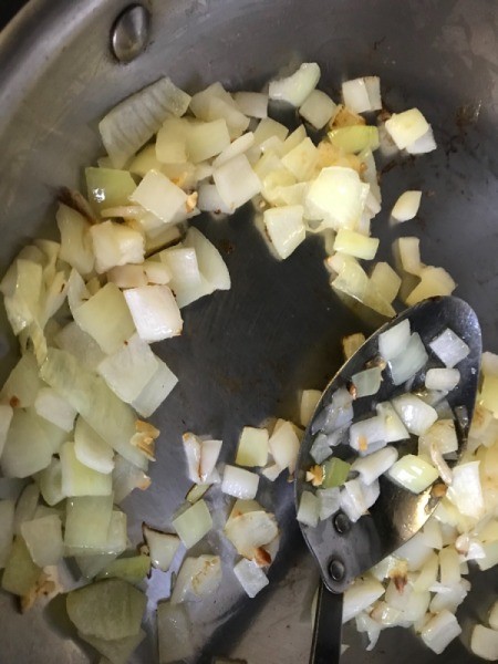 sauteing onions in pan