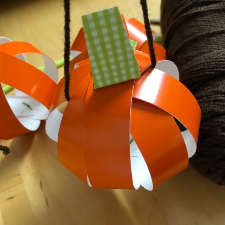 Pumpkin Garland - thread the yarn through the pumpkins