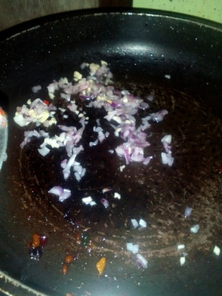 chopped garlic and onions in pan