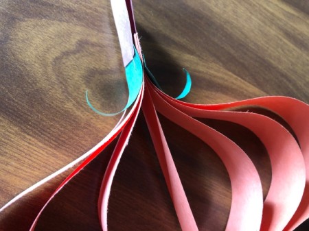 Hanging Paper Pumpkins - use the pencil to curl the leaves up