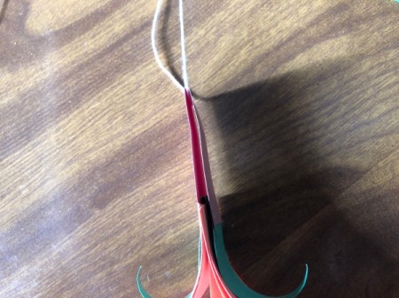 Hanging Paper Pumpkins - pull string through the loop of the stem and hang