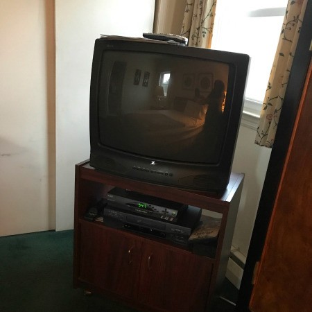 A television in the corner of a room.