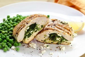 Feta Stuffed Chicken Breasts with aside of peas.