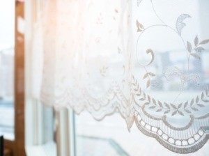Lace curtains on a window.