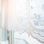 Lace curtains on a window.