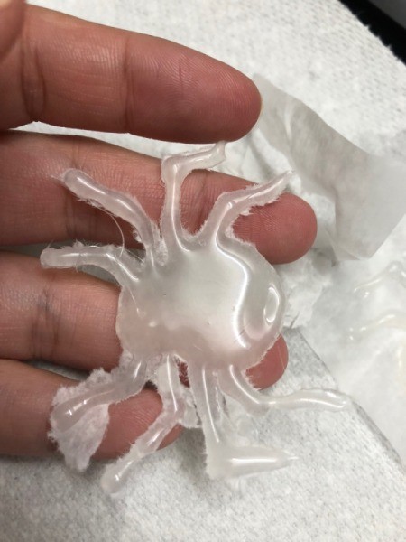 How to Make Hot Glue Spiders - spider after peeled off parchment paper