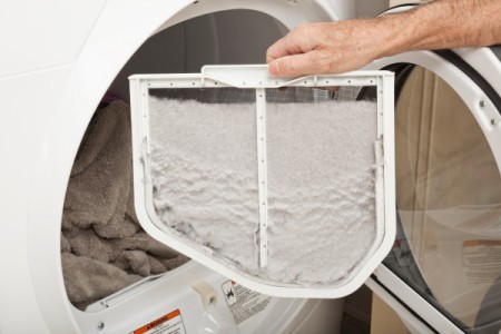 A dryer screen covered in lint.