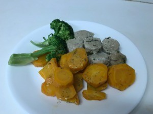 Dilled Carrots with broccohli and sausage on dinner plate