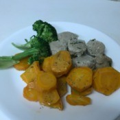 Dilled Carrots with broccohli and sausage on dinner plate