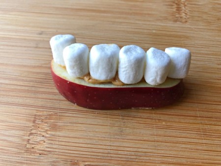 marshmallows on peanut buttered apple slice