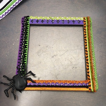 Halloween Seasonal Frame - glue black painted spider to the corner of the frame