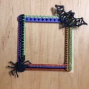 Halloween Seasonal Frame - finished frame with a black bat also glued on the upper corner opposite the spider