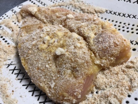 crumbs on egged chicken breast