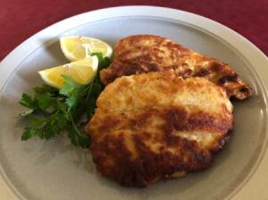 Chicken Schnitzel on plate with lemon bridges