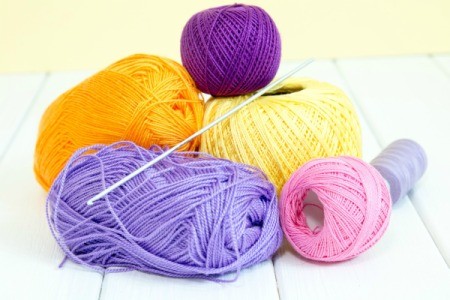 Pile of thin yarn in different colors.
