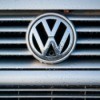 Close up of a VW emblem on a car grill.