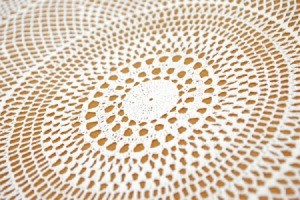 Closeup of crochet tablecloth.