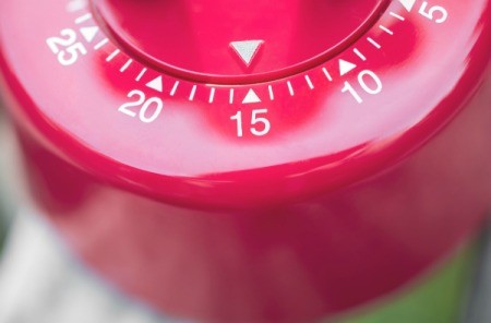 Close up of a red timer set to 15 minutes.