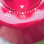 Close up of a red timer set to 15 minutes.