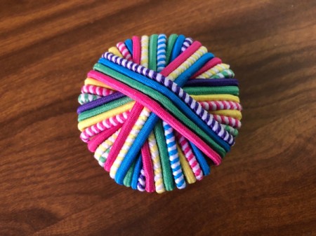 Hair Tie Lollipop Gift - keep crisscrossing the ties on the cardboard circle until it is covered