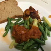 Tomato Sauce on string beans on dinner plate