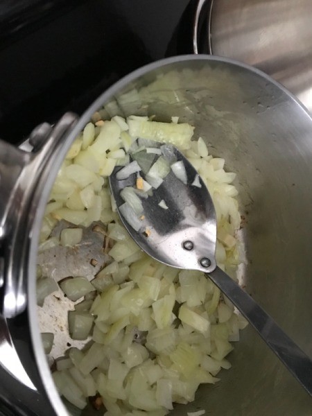sauteing onions in pan