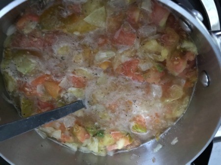 add tomatoes and spices to pan