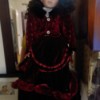 Value of an Ashley Belle Collection Porcelain Doll - doll wearing a deep red velvet outfit