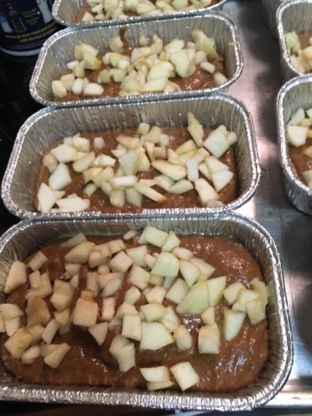 filled bread pans with apples spread on top