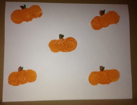 Bottle Cap Pumpkin Stamping - use paintbrushes or markers to add stems and leaves