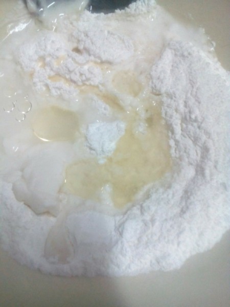 adding water to sugar and flour