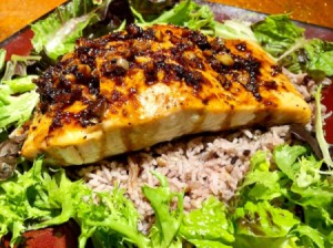 Sweet and Spicy Salmonon bed of rice with lettuce