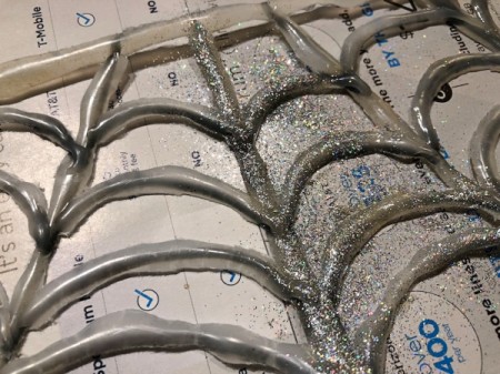 Spiderweb Necklace - once dry peel off of the parchment paper and apply a coat of clear paint and glitter