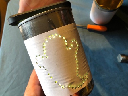 Tin Can Lanterns - check hole size by putting a light inside - increase a hole size as needed