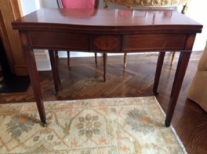 Value of a Brandt Table - vintage mahogany table with small casters on legs