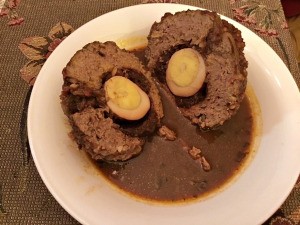 Egg-Stuffed Pomegranate Meatball cut in half