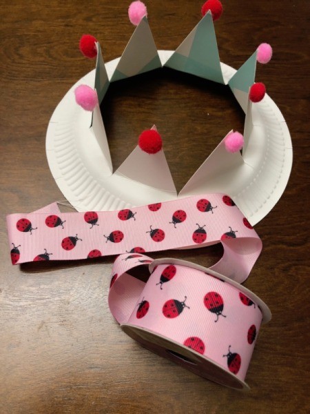 Paper Kids' Crown - crown with a roll of pink ribbon with red ladybugs