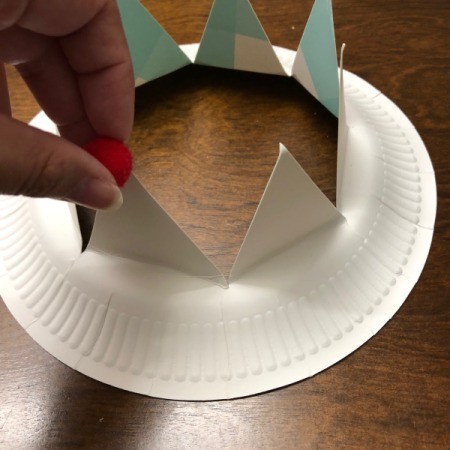 Paper Kids' Crown - adding a pom pom to the tip of one triangle